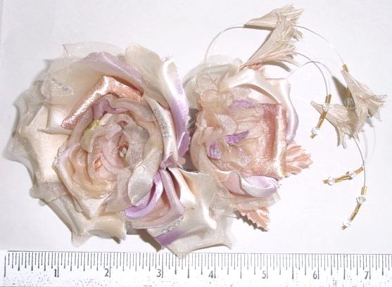 Rose by 2 with stones lovely on a ladies suit dress manufactures
